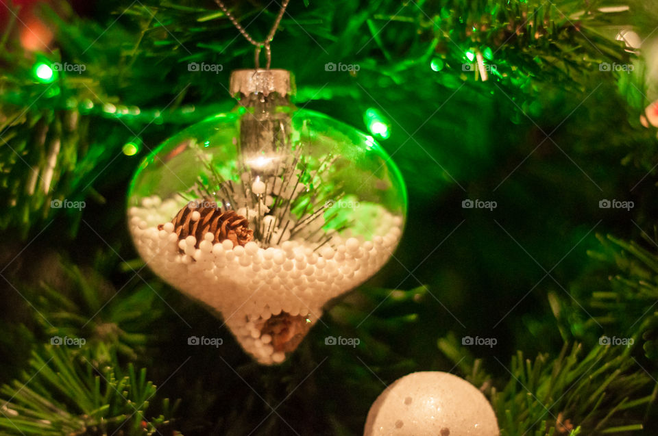 Christmas tree decoration element with artificial snow inside 