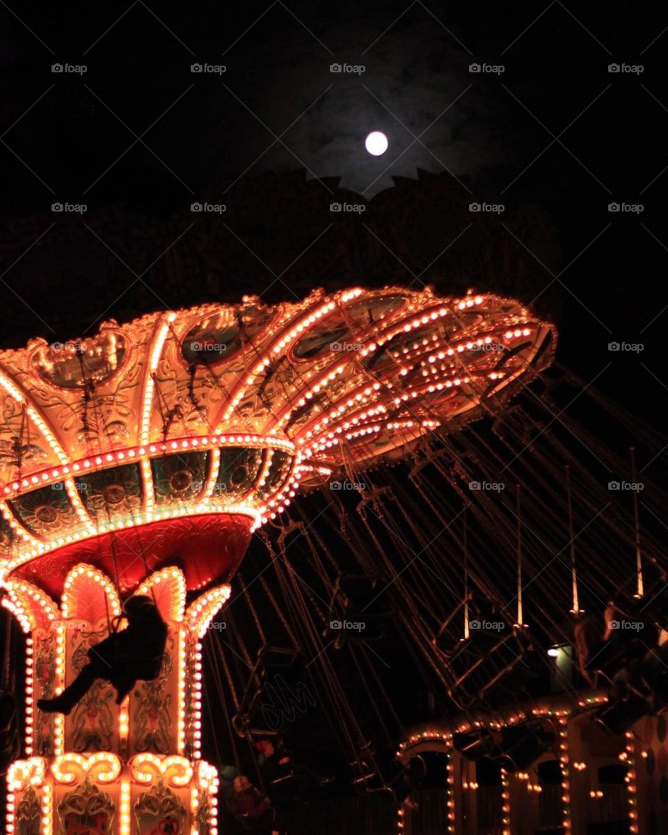 Swings merry go round at night