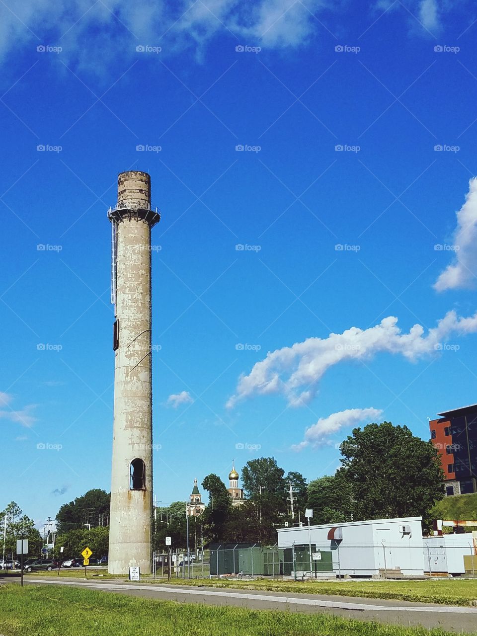 Old smokestack towers above