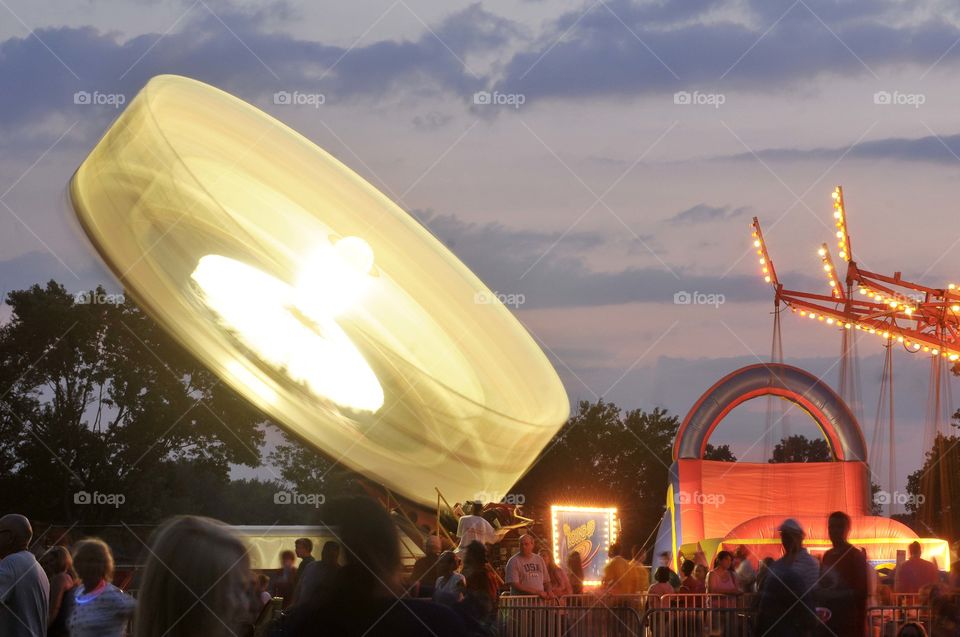 Beauty in motion. Night time excitement, amusement park rides. 