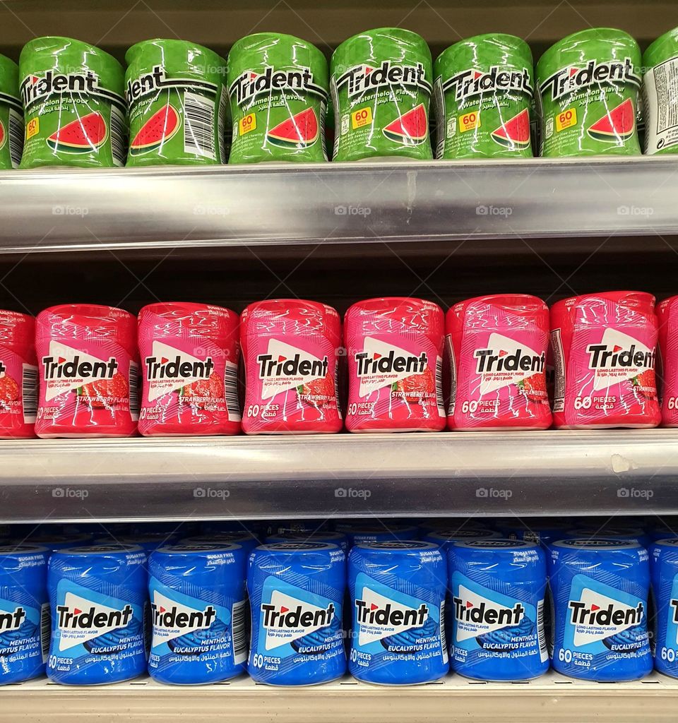 Rows of Trident Gum Tins