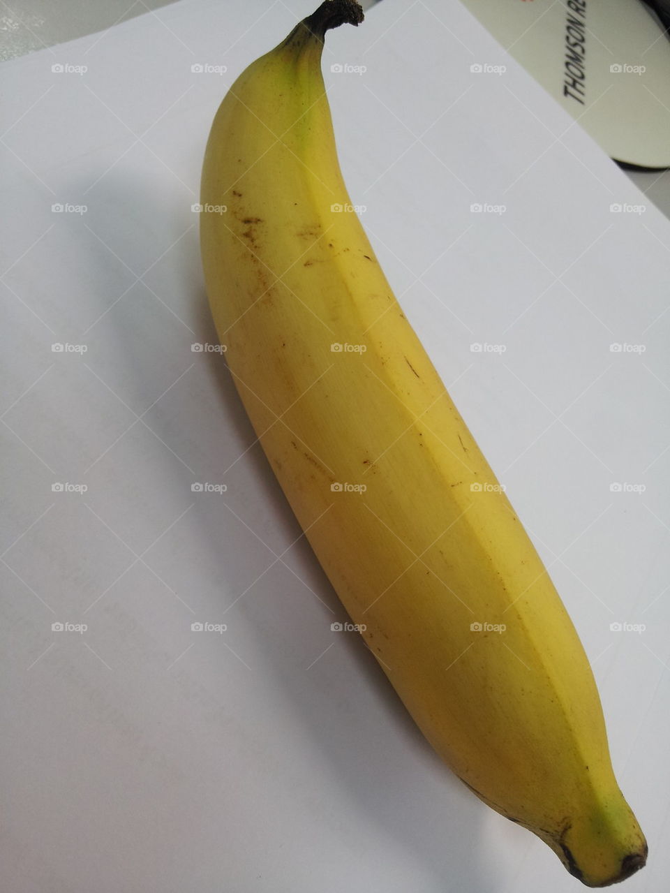 Yellow Banana on white table
