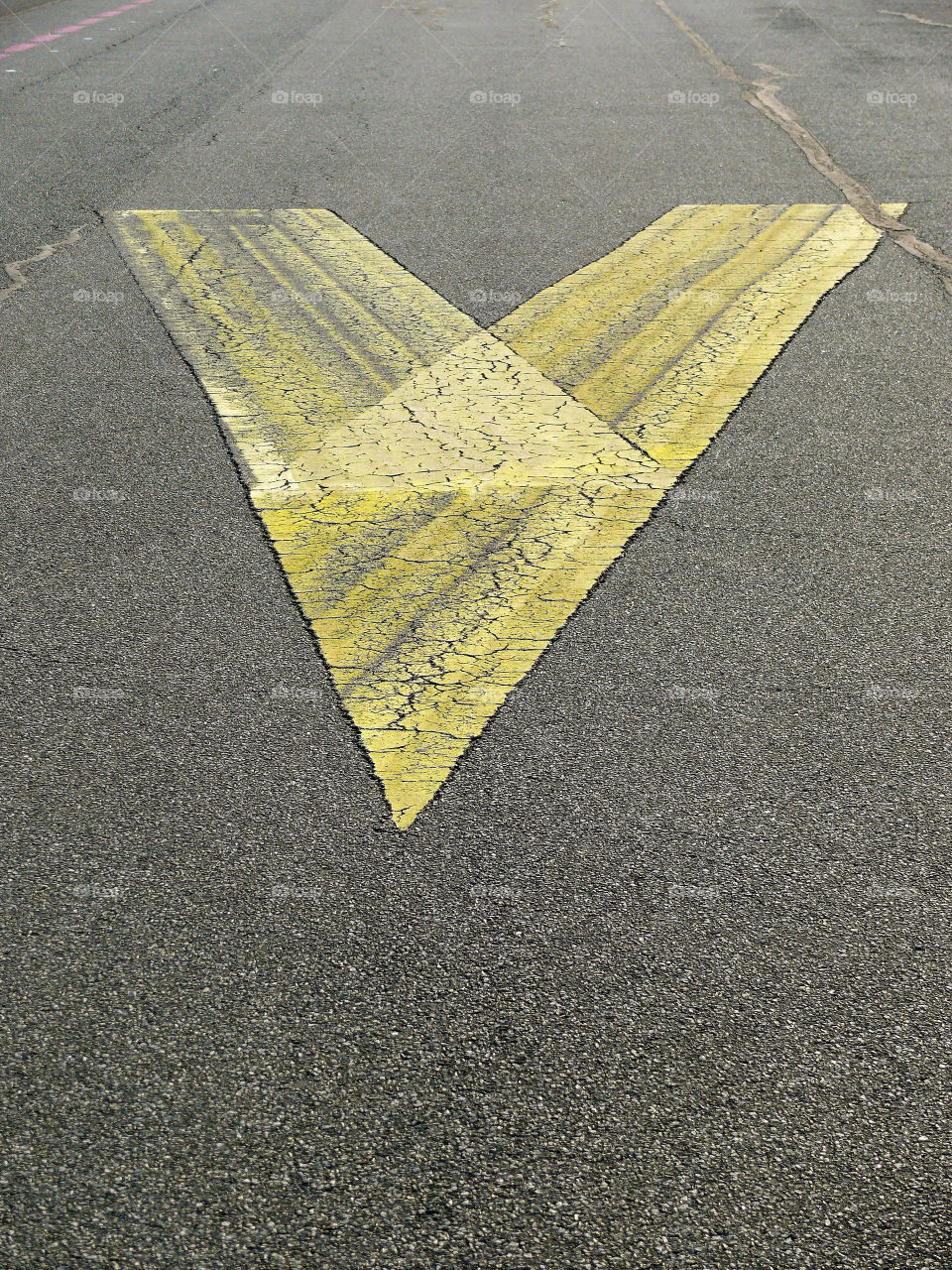 High angle view of yellow road marking on asphalt