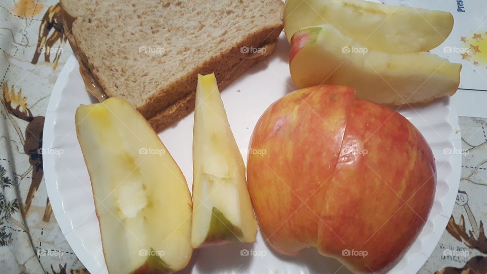 apples and a peanut butter sandwich