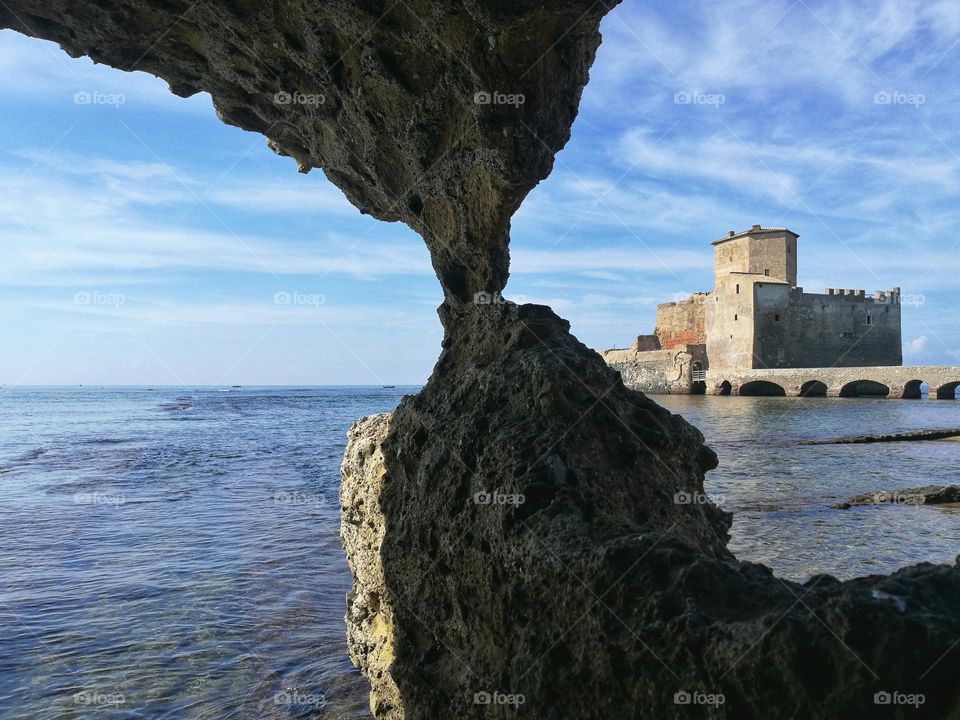 glimpse of the medieval Astura tower photographed from the sea