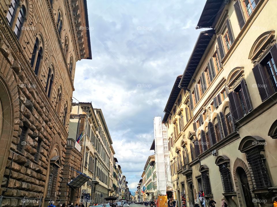 Buildings in vintage design with cloudy sky in Florence, Italy.