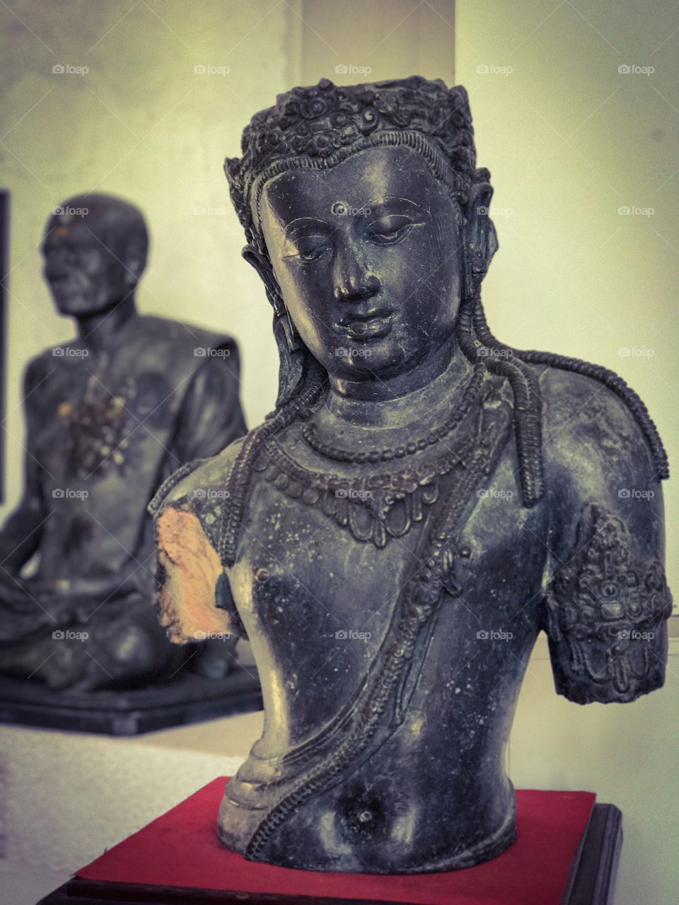 Statue of Bodhisattva Avalokitesvara who embodies the compassion of all Buddhas displayed in Chaiya National Museum, Surat Thani, southern Thailand