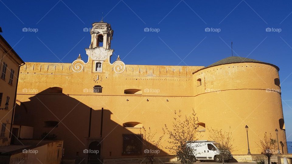 Palace of Governors with bell tower, sundial and Torrione, dongeon square, in Citadel historic district in Bastia (Corsica)