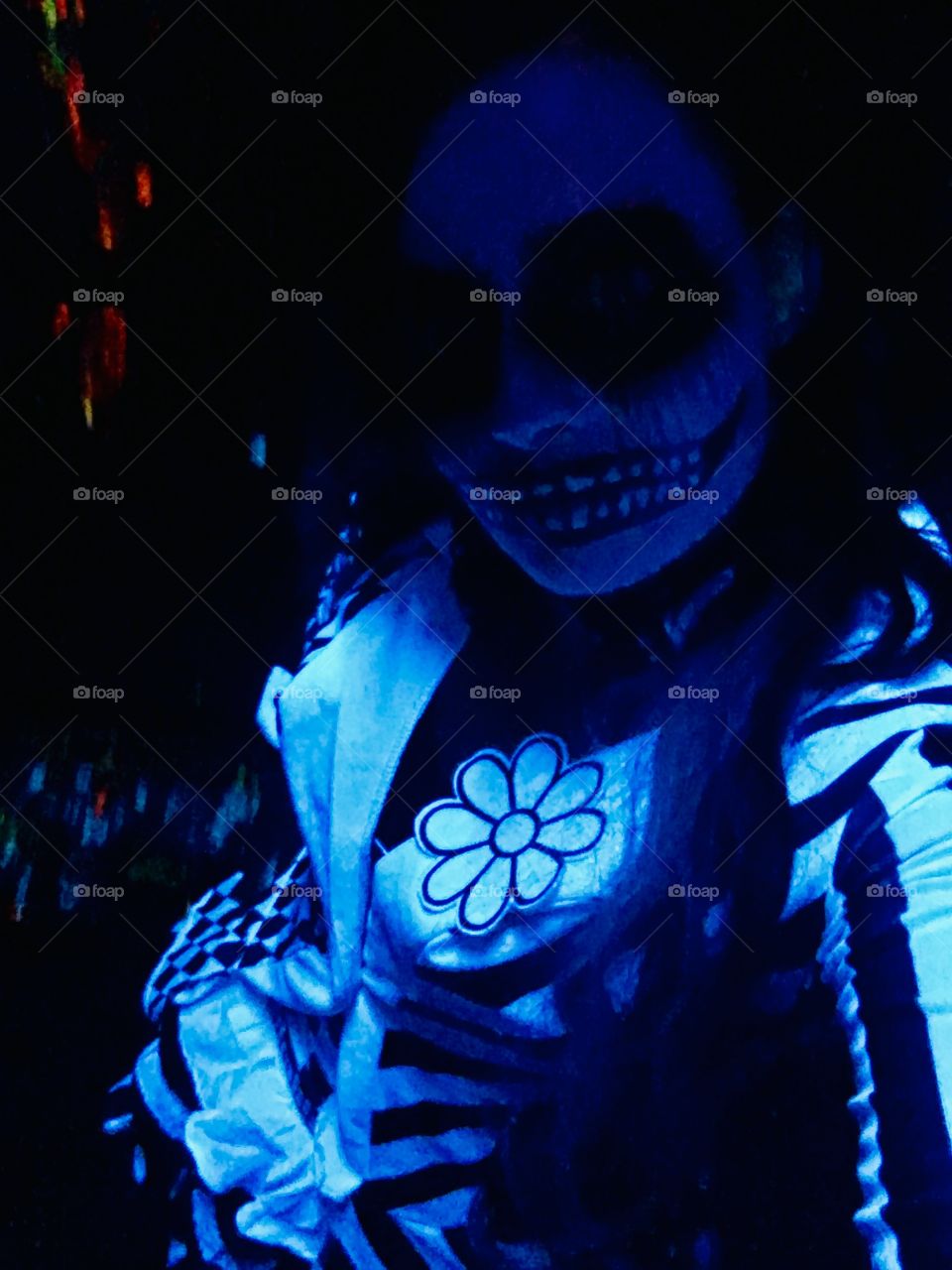 A self photo of me in my clown costume under black lights 