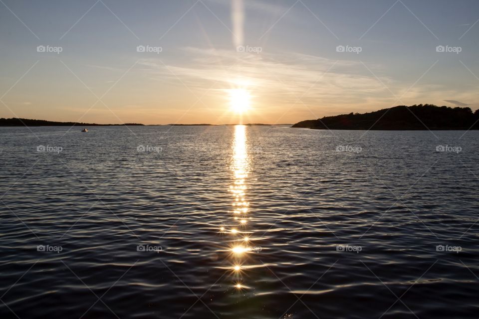 Beautiful sunset by the ocean in June