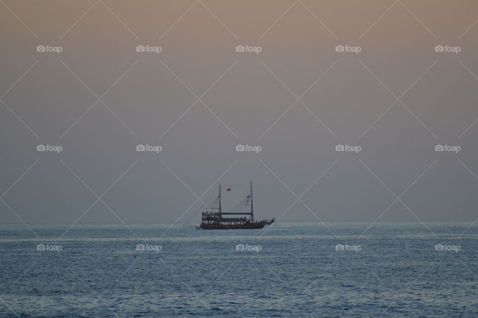 ship sailing off into the sunset