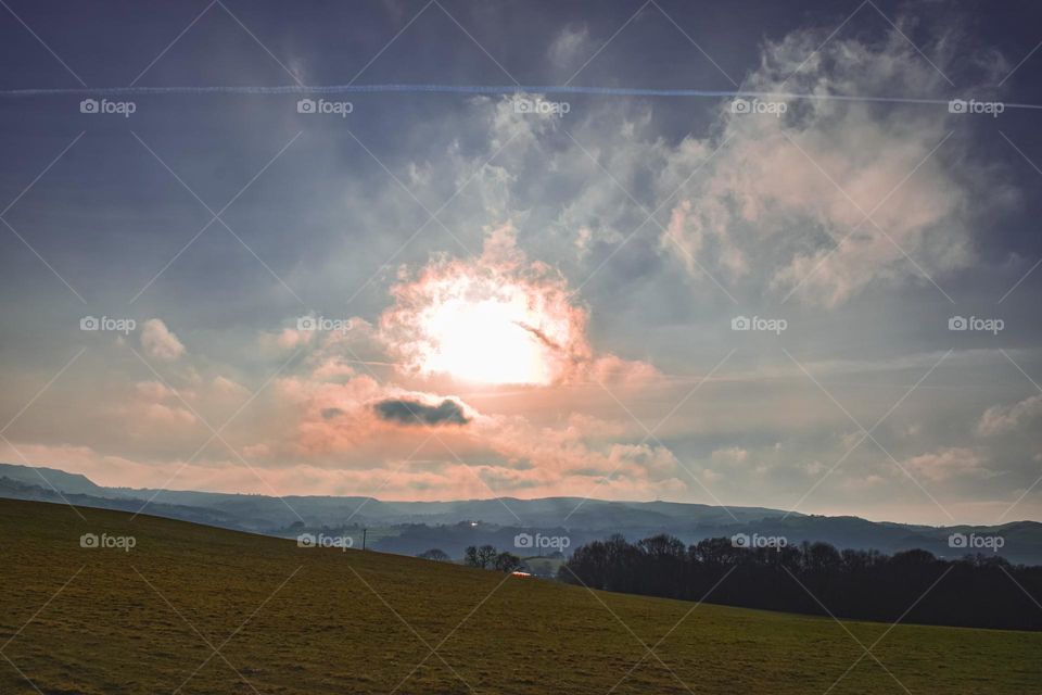 Atomic sunrise over peaceful hills