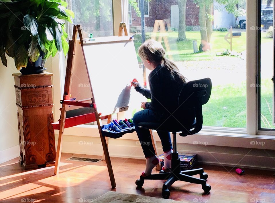 Gorgeous front window makes for perfect lighting for artwork on the big art easel! 
