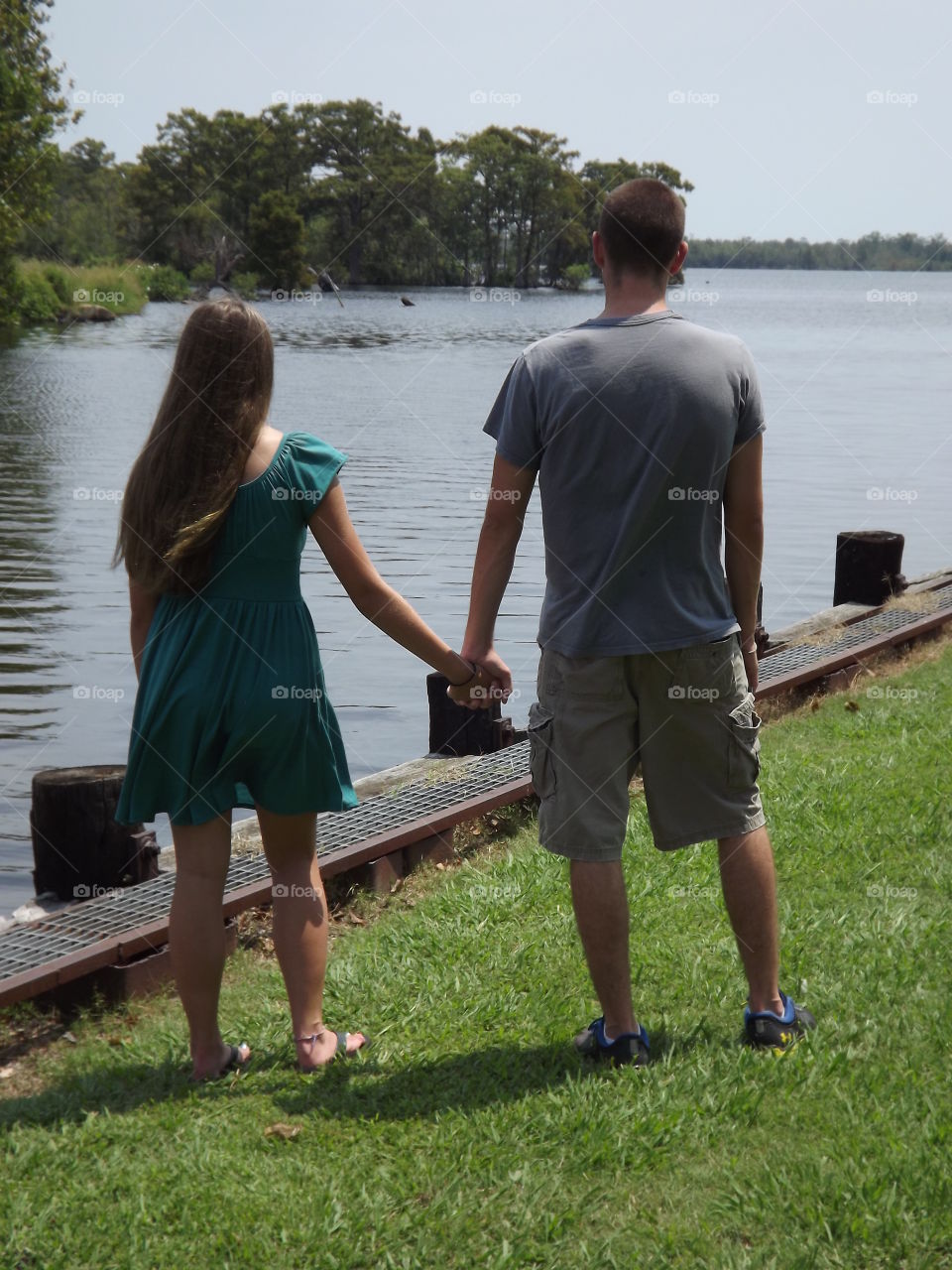 holding hands by the river