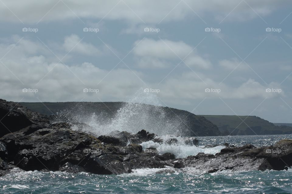 Waves crashing on rocks on the coastline