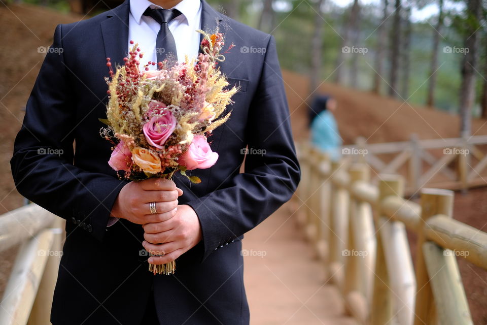 Groom with flowers
