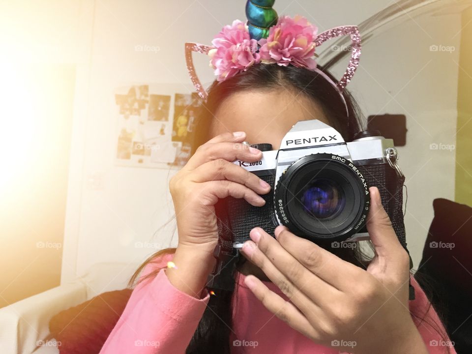 little girl taking a picture