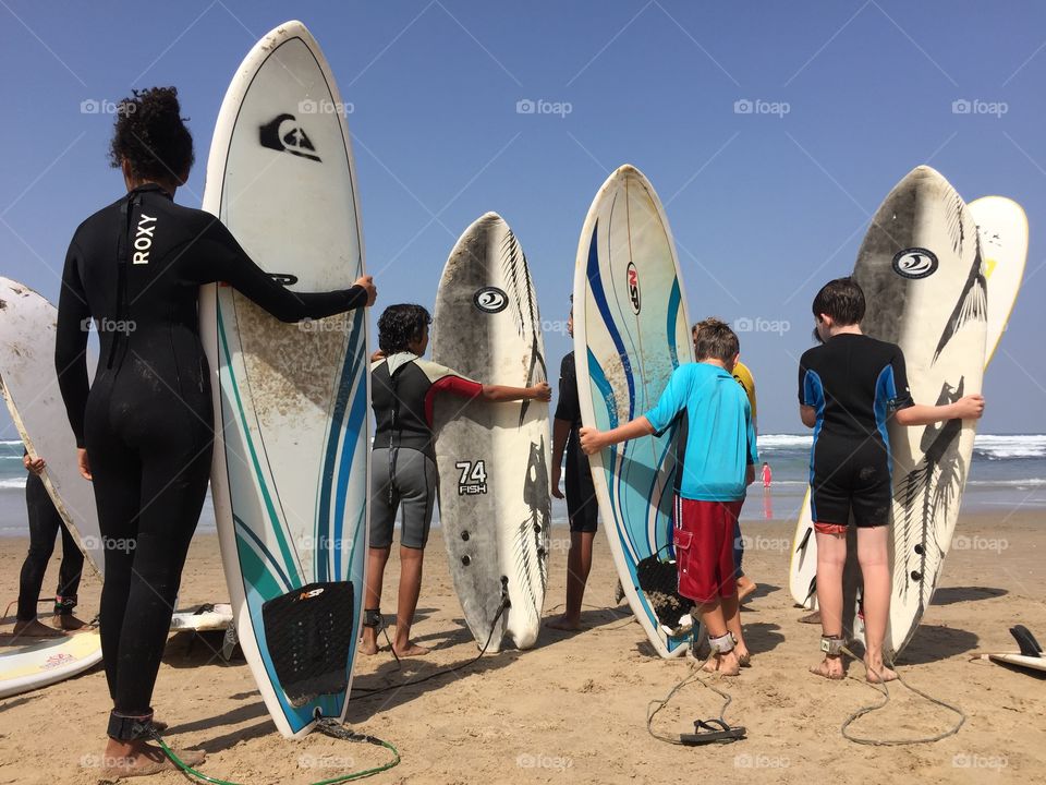 Kids learning to surf.