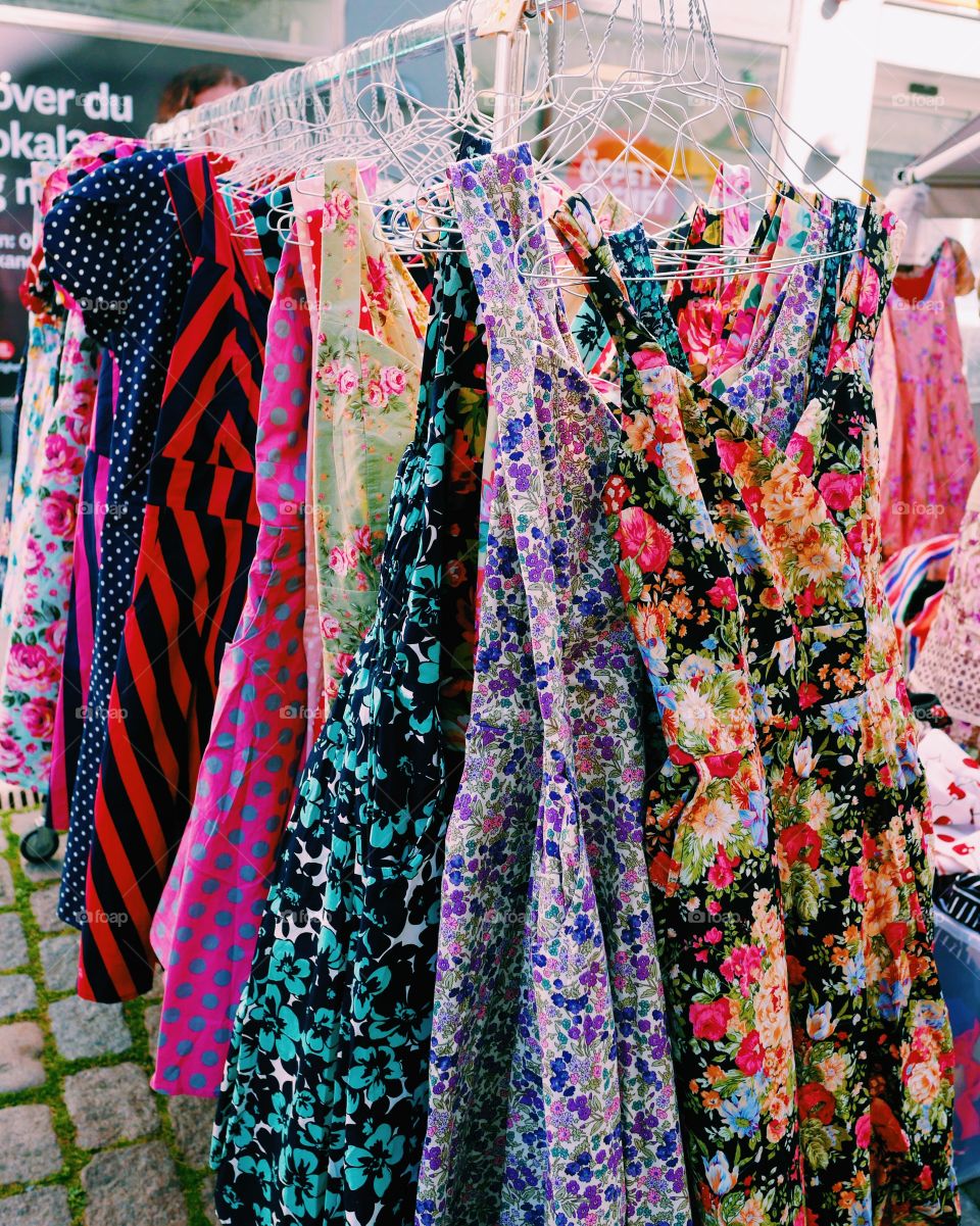 Beautiful patterned dresses on a rack