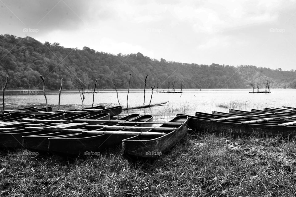 monochrome portrait of old fisherman boat at the lakeside