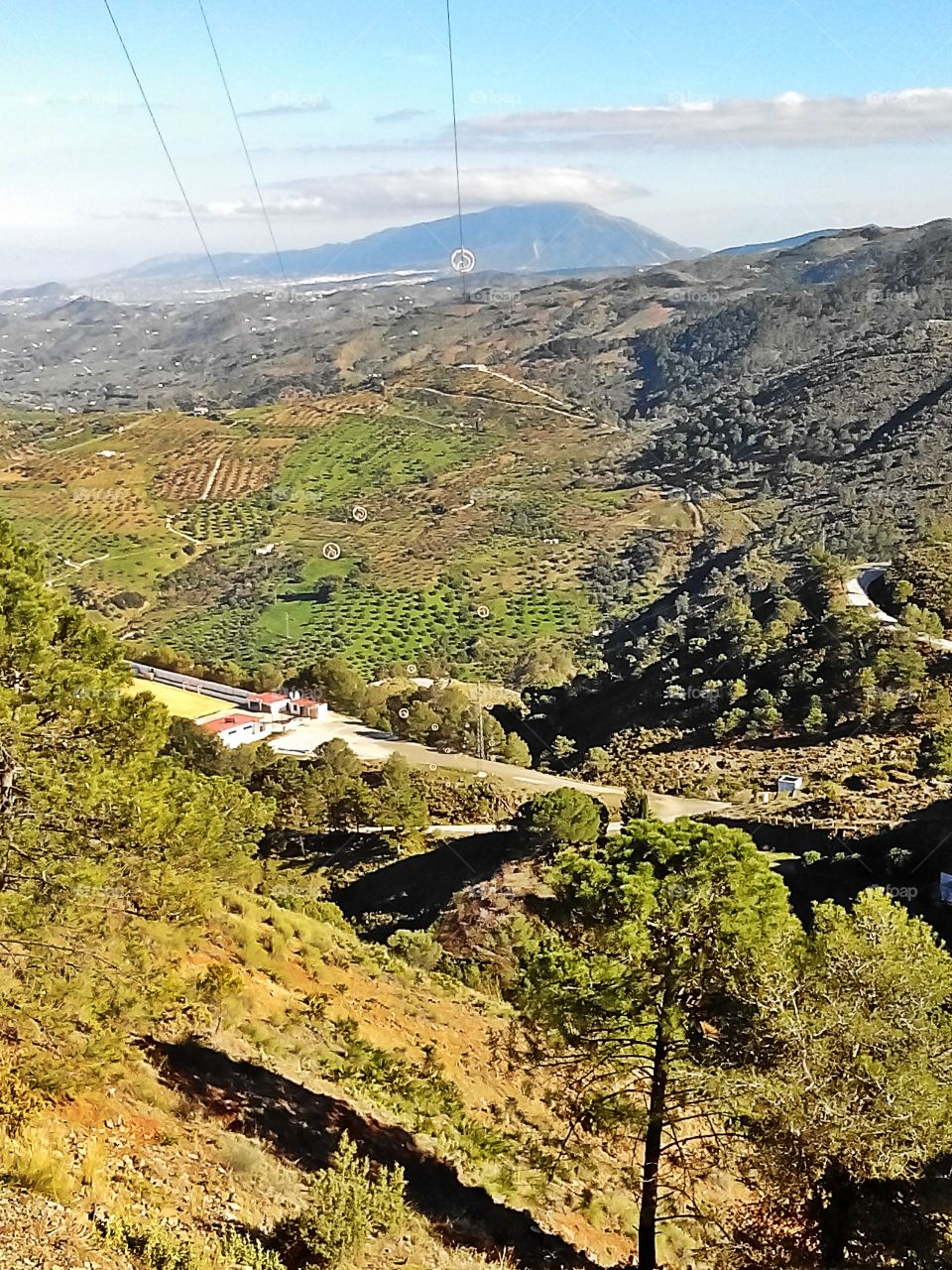 Mountains of Tolox,  Andalucia . View to the orange orchards and olive groves from Tolox Mountains in Andalucia, Spain 