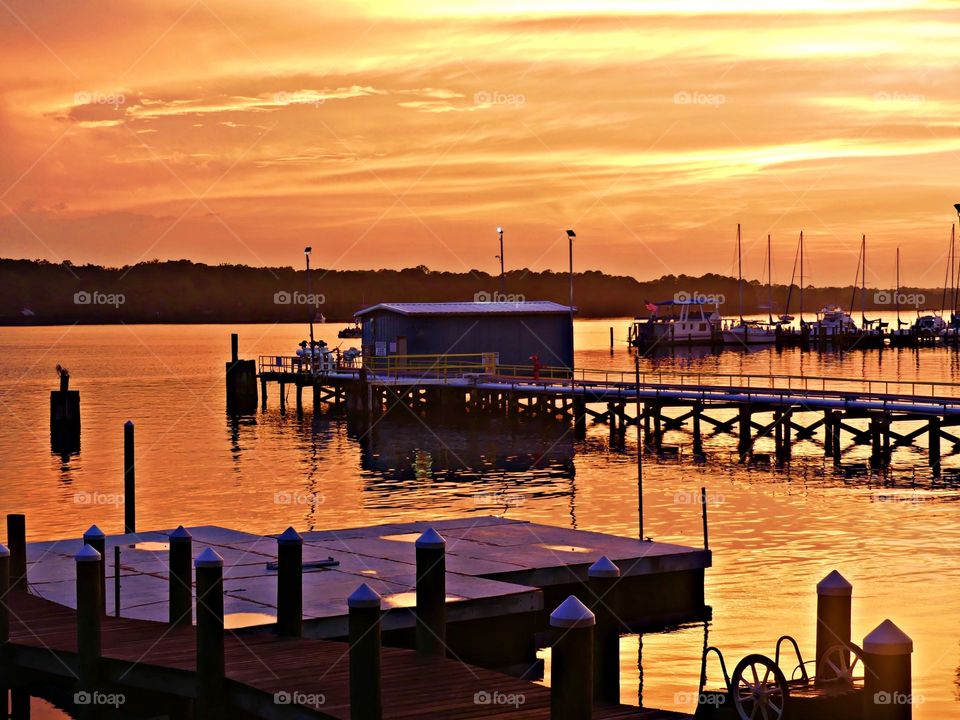 Golden hour time - After a rain shower, a Liquid gold sunset surrounds the sky and the idle sailboats moored in the bayou. The Golden Hour offers plenty of opportunities for great photos, and the really beautiful thing is that it happens twice a day