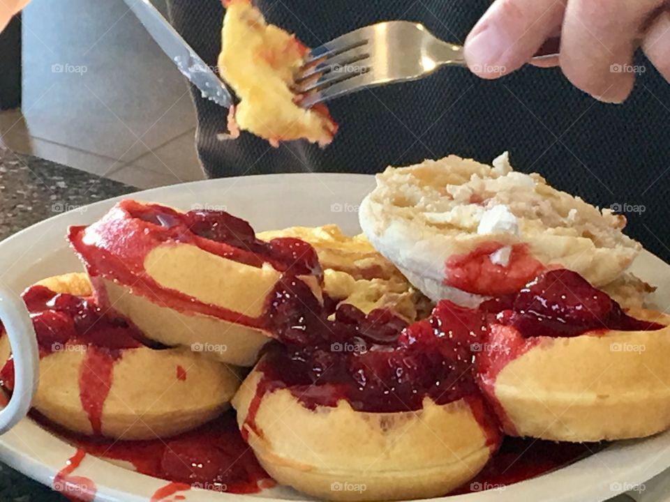 Red berries sauce on waffles