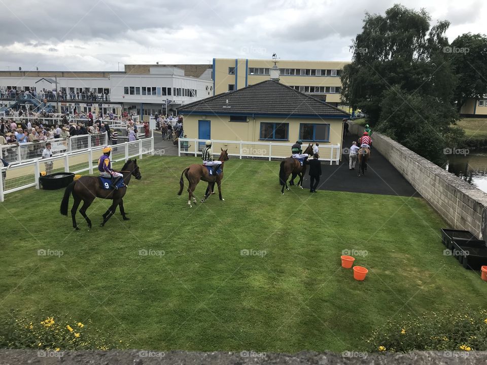 Mid afternoon Devon horse racing, my photo shows some of the jockeys heading out for their race.