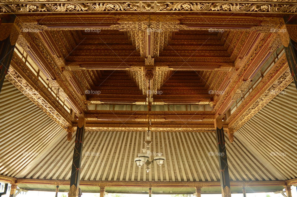 beautiful carving a roof in the palace yogyakarta