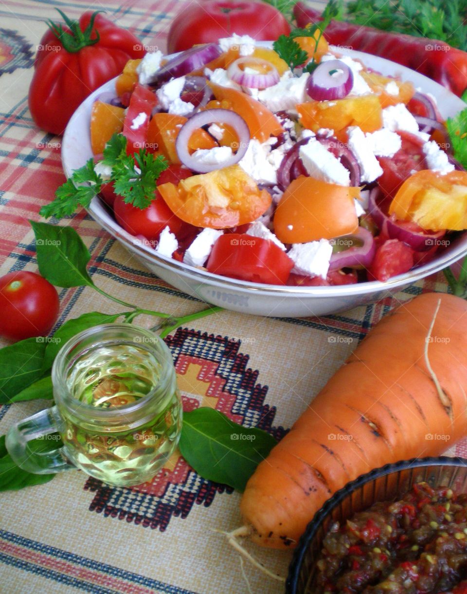 Traditional vegetables salad and alcohol drink