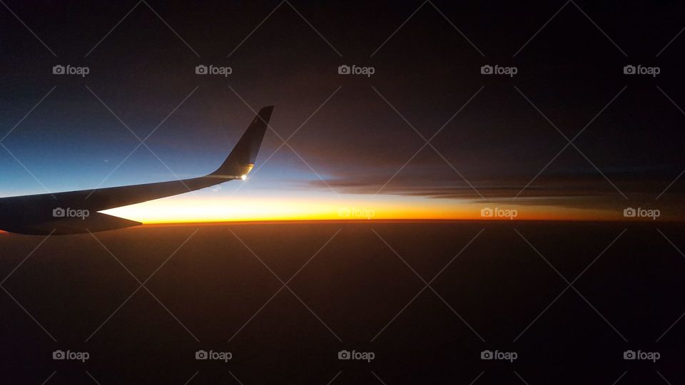 Sunset in a plane