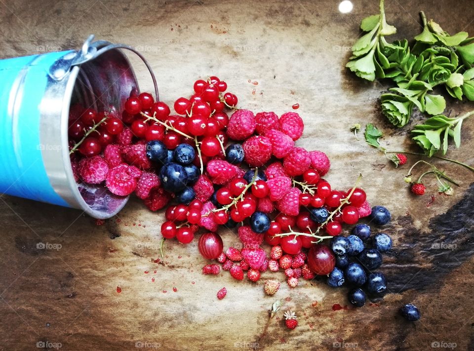 Different berries on a rustic background
