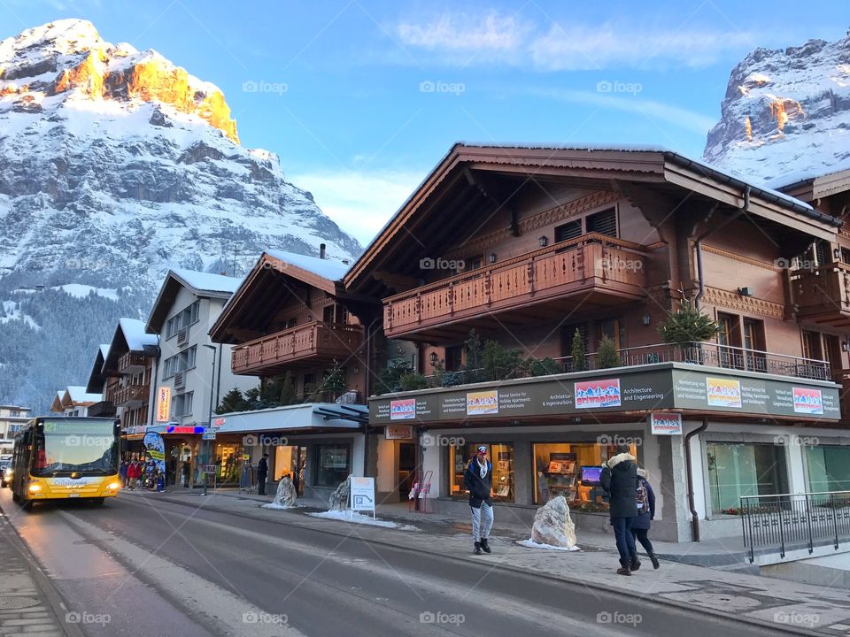 Wooden cottages and alps view in Grindelwald, Switzerland 