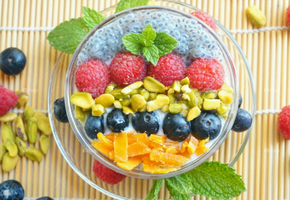 Smoothie Fresh Fruits Bowl - raspberry, blueberry,  mango, nuts and basil seeds