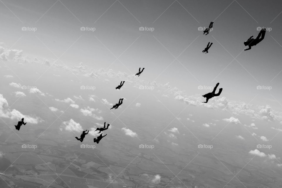 diving. people jumping from 2 different planes to meet in a formation during a trainning session to 81 dimond
