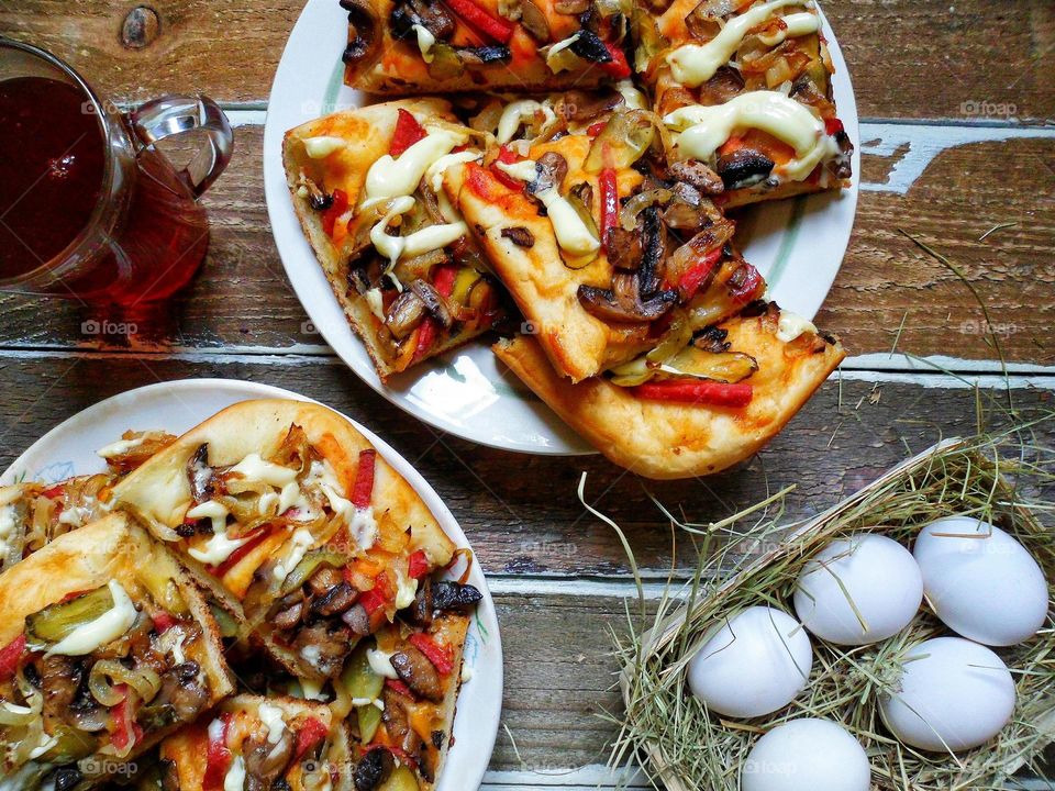 homemade pizza, a cup of tea and eggs