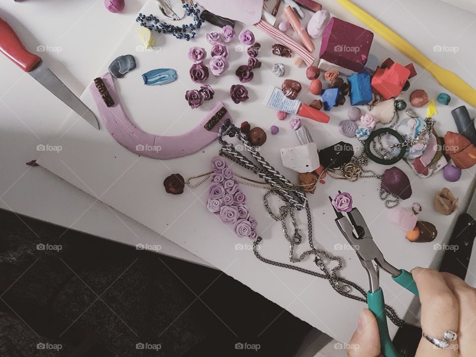 Hands making jewellery from scratch