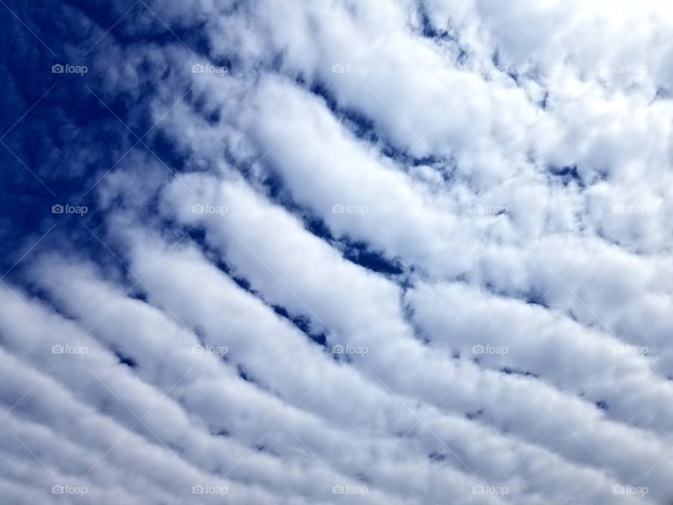 Blue and white stripes.
Diagonal stripes in the sky.