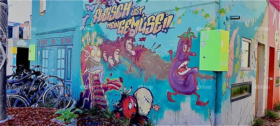 Another impression of the former „Olympic Village“ in „Munich“ or „München“ the „Bavarian“ capitol. The individual houses are all covered in bright colorful graffiti style murals. 2022. Hypnotic Productions