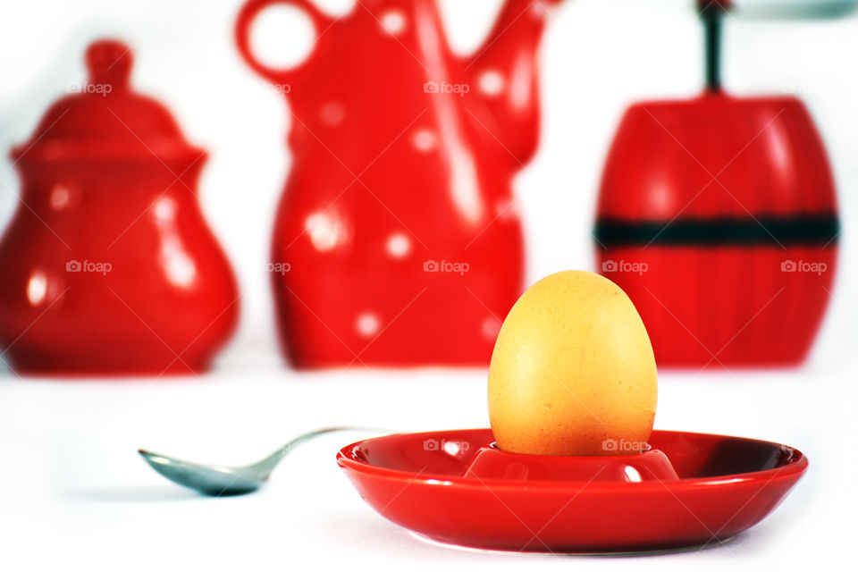 Egg on red holder