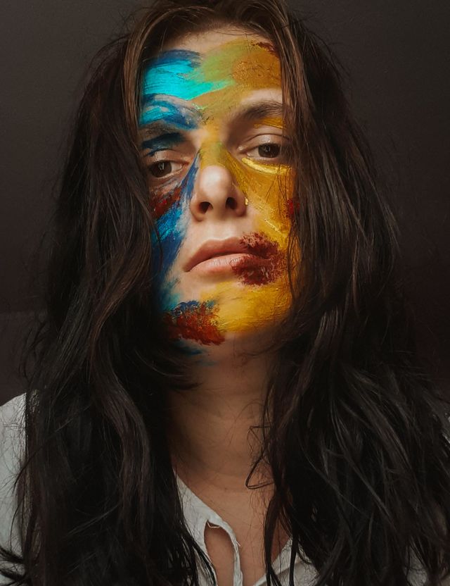 a portrait of a wounded girl that illustrates Ukraine, which is fighting for its independence