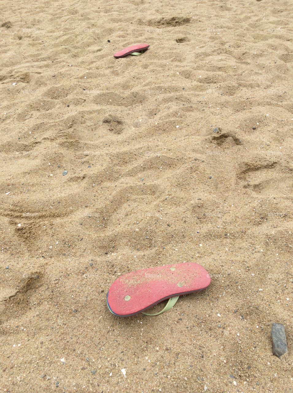 Abandoned sandals on the beach