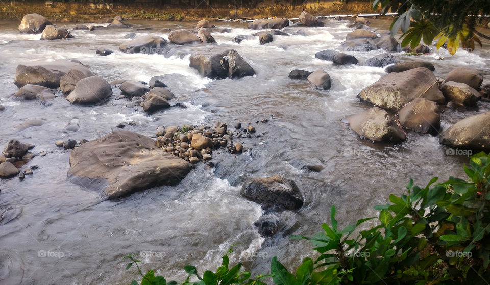 flowing river with rocks