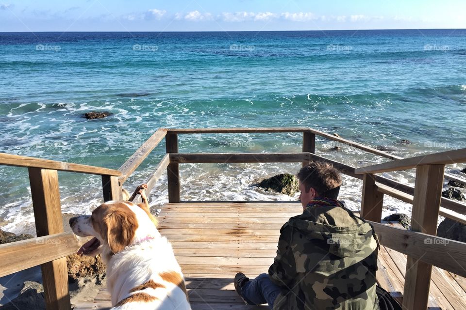 Man and his dog by the sea