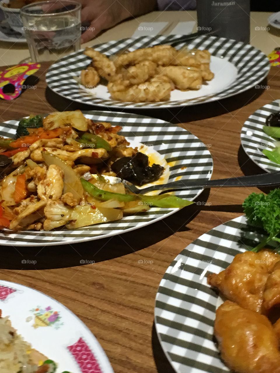 Chinese chicken stir fry on checkered plate 