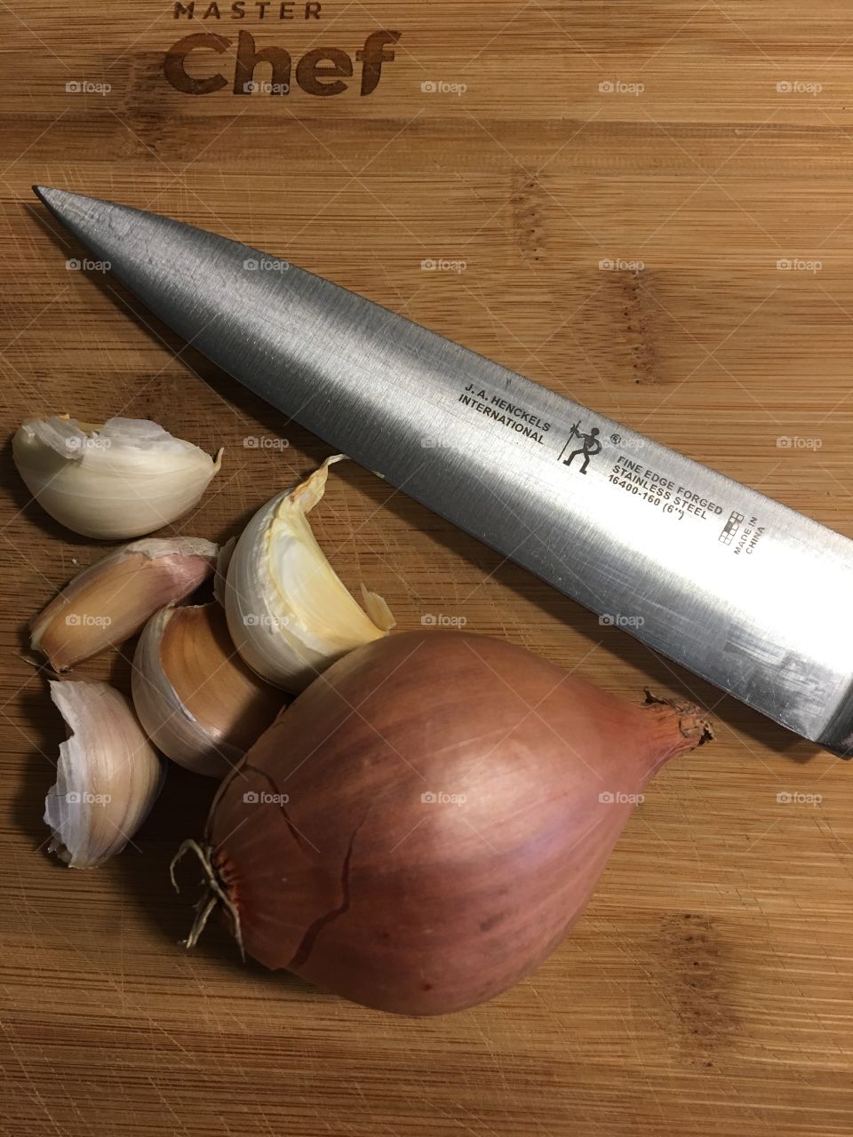 Garlic cloves and a shallot