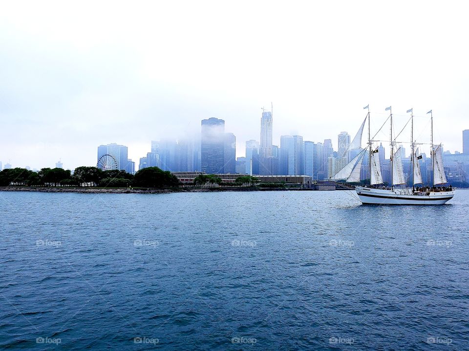 View of foggy downtown Chicago and The Tall Ship Windy from Lake Michigan