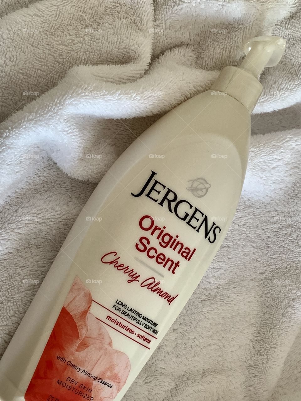 Jergens orginal scent cherry almond body lotion with white background. 