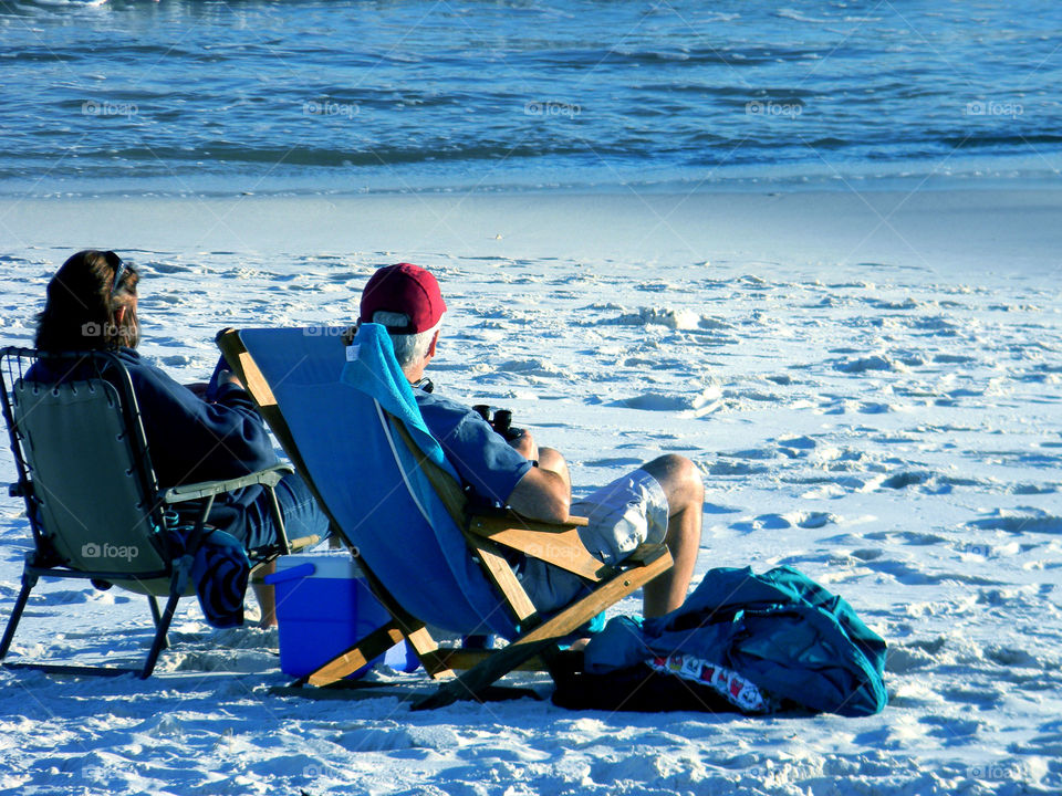 Chilling. Couple chilling at the beach