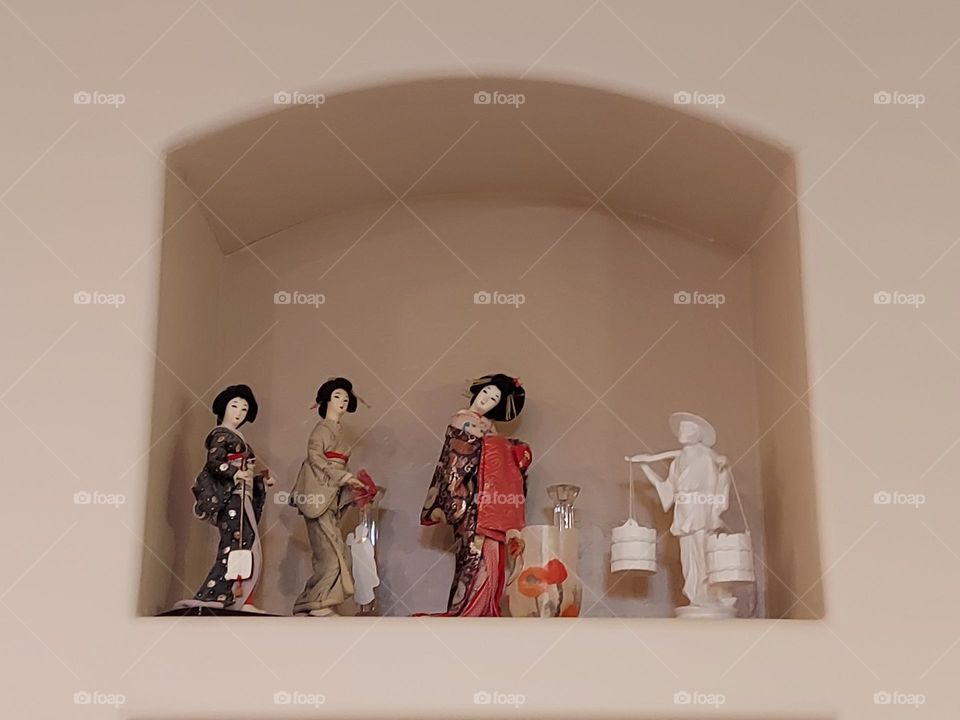 dolls on a shelf